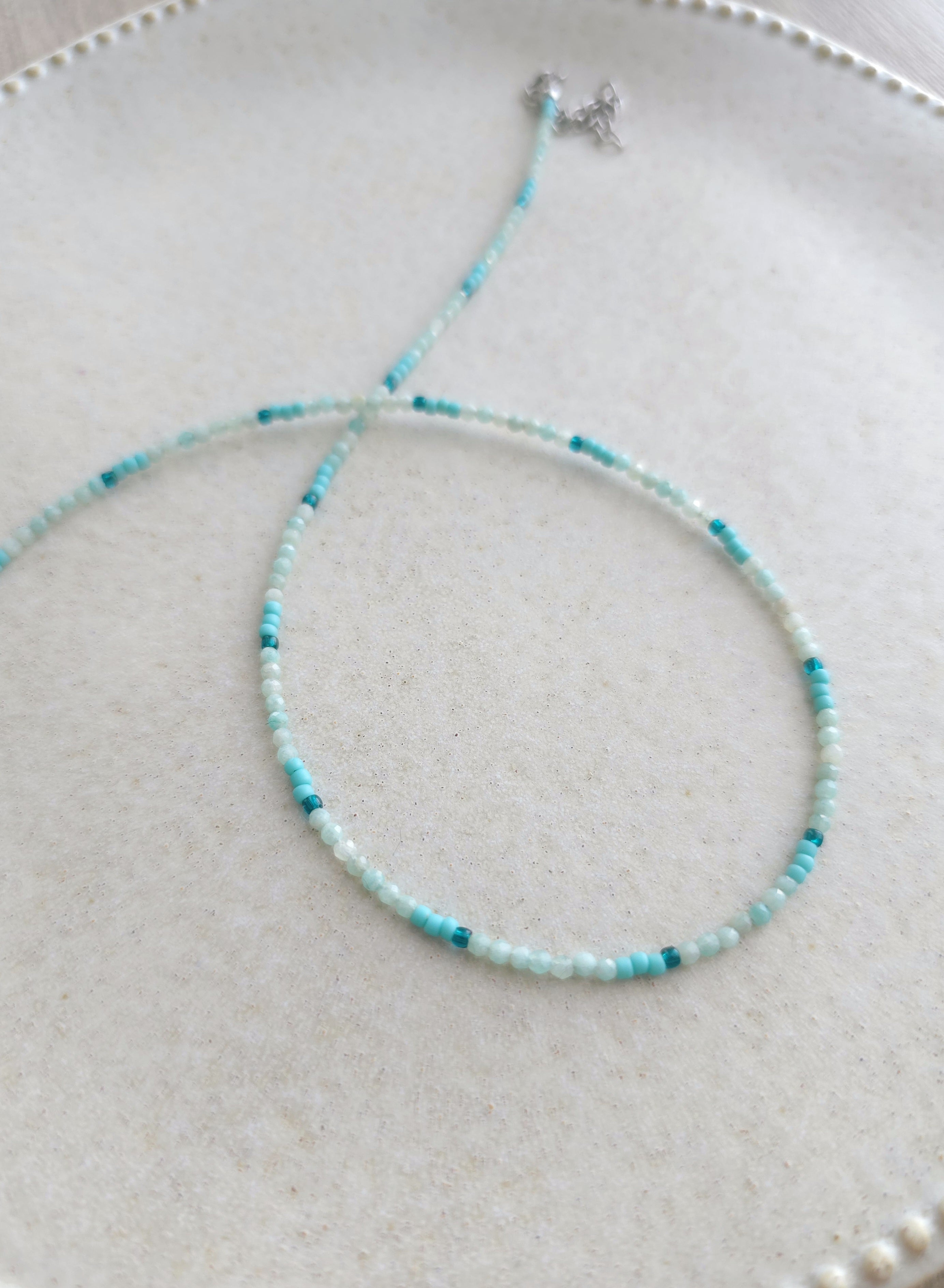 adjustable length tiny beads necklace in light blue color