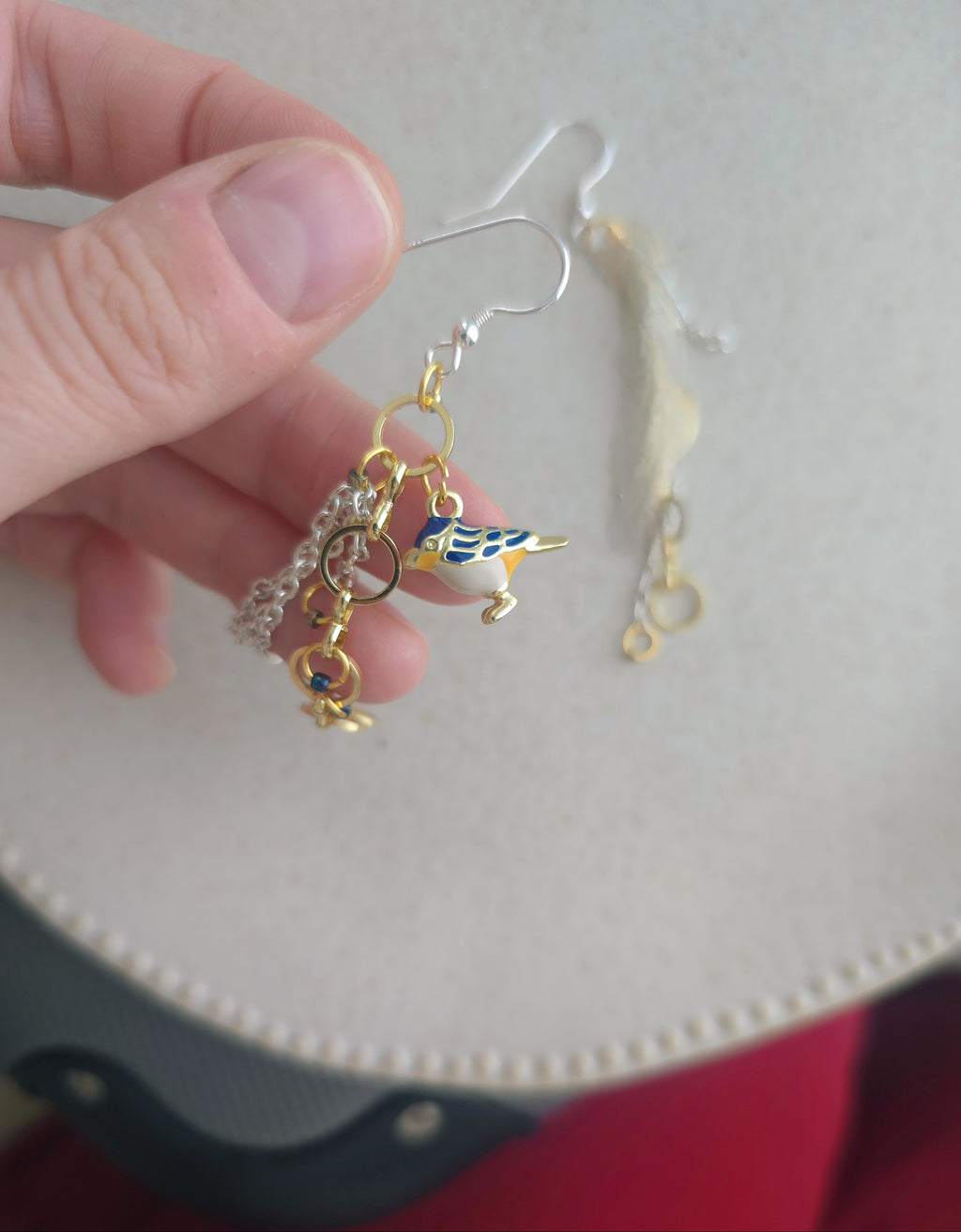 Chain earrings with blue bird pendant. Silver hooks