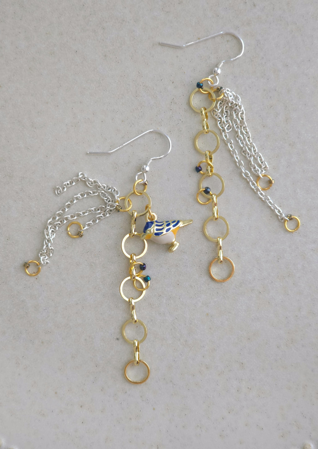 Chain earrings with blue bird pendant. Silver hooks