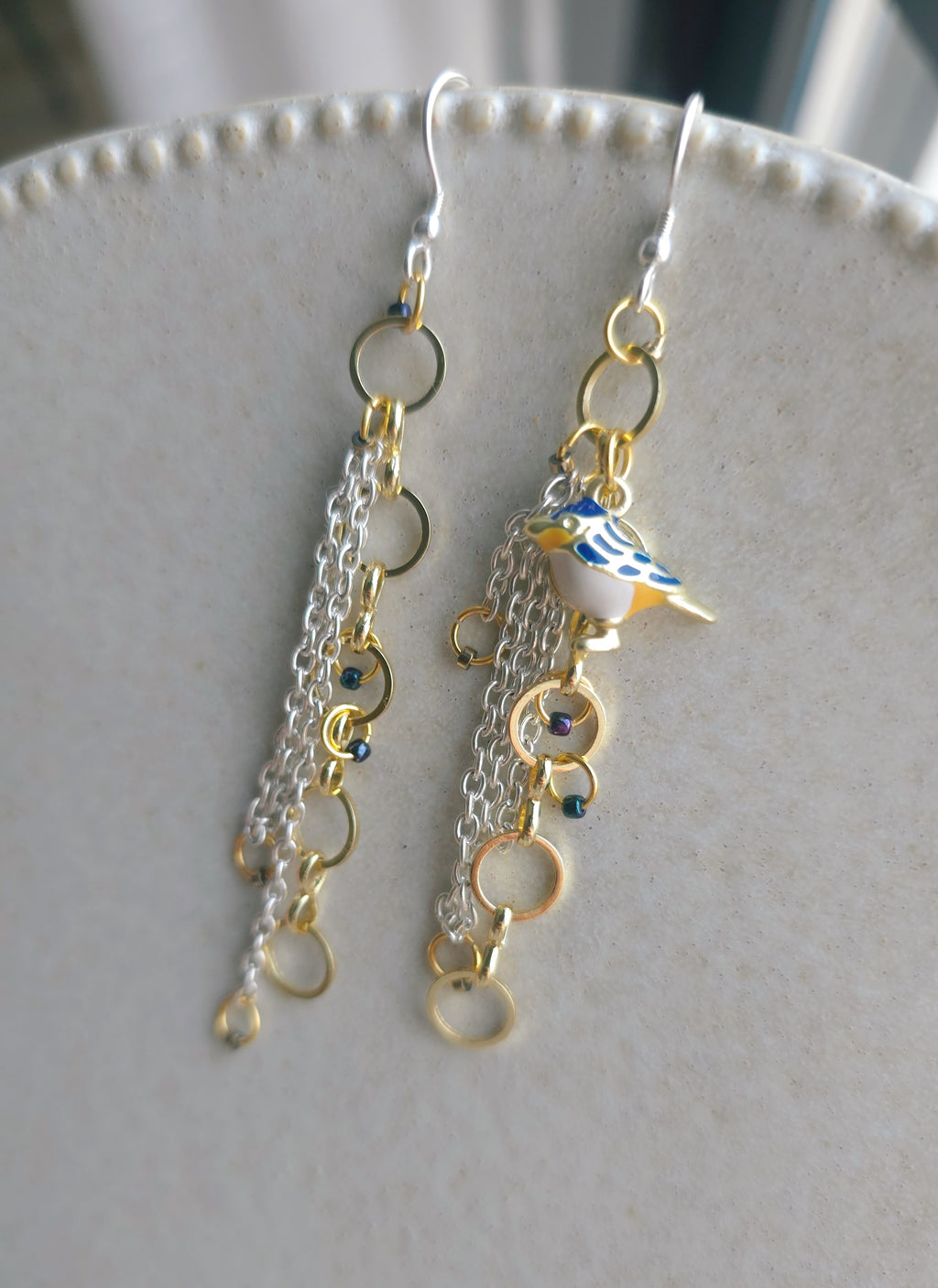 Chain earrings with blue bird pendant. Silver hooks